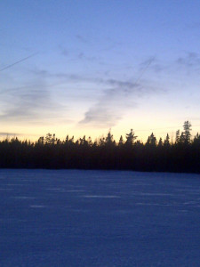 April sunset on the frozen lake